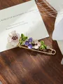 Close-up of a floral enamel brooch featuring purple tulips and sparkling crystal accents - White and Purple Tulip Style (A17-11)