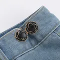 Elegant black rose metal waist cinching buttons for jeans, retro style on denim - Black Camellia Style
