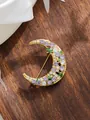Detailed view of a crescent moon brooch with purple and white crystals on a wooden surface. - Crescent Moon Purple and White Rhinestone (A23-154)