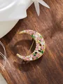 Close-up detail of a crescent moon brooch with pink rhinestones and gold finish - Crescent Moon Pink and White Rhinestone (A23-153)