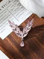 Elegant pink crystal angel wing brooch detail with a shimmering teardrop charm. - Pink (A9-46)