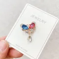 Butterfly brooch pin with blue and pink crystals on white display card - Blue and Pink Butterfly Rhinestone Style (A10-62)