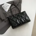 Stylish black quilted puffer tote bag with large capacity and underarm shoulder straps - Black