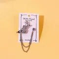 Eleganter silberner Geigen-Brosche mit Quastenkette und Strasssteinen. - Violinenstil (19) / Silber