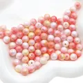 Dettaglio macro di perle acriliche bicolore iridescenti per la creazione di gioielli - 8mm 20g/Confezione (Circa 80pz) / Serie Rosso Arancio