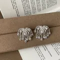 Detailed view of elegant silver firework tassel stud earrings with zircon and pearls - Style 33 Earrings
