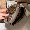Detailed view of a stylish wide leopard print headband with a soft fabric finish - Headband / Leopard Coffee Border