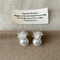 Elegant silver fireworks pattern stud earrings with large round white pearls detail - Style 23 Earrings