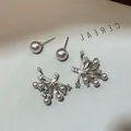 Detail view of pink pearl firework stud earrings with zircon for a front-back wear look - Style 24 Earrings