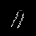 Detail view of elegant zircon tassel earrings with sparkling teardrop crystals on black - Zircon Tassel Earrings / 925 Silver Earring Post / Gold Plated