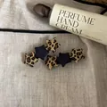 Close-up view of stylish leopard print and navy fabric star hair clips on linen background - Star Hair Clip / 1PCS / Navy Splicing