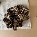 Close-up detail of a vintage leopard print scrunchie with silky satin fabric texture - Scrunchie (6#) / Leopard Print