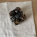 Close-up detail of a vintage leopard print fabric bow hair claw clip on grey background. - Bow Hair Claw (7#) / Leopard Print