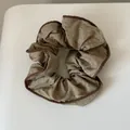 Macro detail of a brown polka dot pleated fabric scrunchie hair tie for women - Scrunchie / Coffee Polka Dot Scrunchie