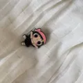 Detailed macro shot of a cute retro cartoon girl character charm with a pink headband - 15# Black White Dot Dress Girl