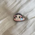 Detailed close-up of a retro cartoon girl enamel pin on textured fabric background - 14# Blue Plaid Dress Girl