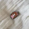 Detailed macro shot of a cute cartoon girl enamel pin featuring a large pink bow decoration - 9# Pink Dress Girl