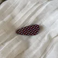 Detailed view of a vintage style acetate hair clip with light blue polka dots on brown. - 5# Coffee Waterdrop Clip