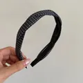 Detail of blue and black gingham twisted headband showing inner anti-slip comb teeth - Black Grey Plaid
