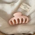 Minimalist light pink large claw clip shown against a neutral linen background - Solid Pink