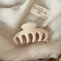 Detailed view of a large cream-colored Korean style hair claw clip on fabric background - Solid Cream