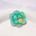 Green flower-shaped acrylic charm accessory with Safe Travels Chinese text print. - 39x42mm (1 Piece/Pack) / Peace Coming and Going