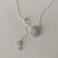 Detailed view of the sparkling crystal grape cluster on an adjustable silver lariat necklace - Blue Necklace (Gold Plated) / Blue