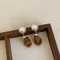 Detailed macro view of elegant Maillard style brown resin drop earrings with pearl studs - Style 11 (925 Silver Post)