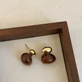 Elegant brown resin and gold metal ball drop earrings for women displayed in wooden tray - Style 14 (925 Silver Post)