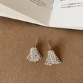 Close-up of silver firework stud earrings with intricate beaded tassel design - Style 2 Snowflake Earring