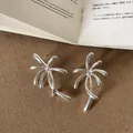 Close-up of silver metal firework earrings showing unique artistic design details. - Style 3 Earrings
