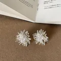 Intricate silver firework stud earrings with pearls and crystal details - Style 5 Earrings