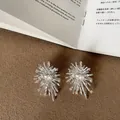 Exquisite macro detail of silver fireworks design earrings with sparkling crystal studs - Style 17 Earrings