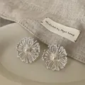 Elegant silver fireworks stud earrings with white pearl center for unique women fashion - Style 22 Earrings