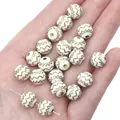 Detail shot of white acrylic beads featuring gold-painted wavy patterns on a palm - Black / 10mm Wave Pattern Beads Approx. 50pcs/Pack