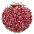 Macro detail of red silver-lined glass seed beads in a decorative silver bow tray - Silver Crimson