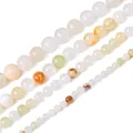 Différentes tailles de perles rondes en pierre synthétique pour création de bijoux - Jade Fleurie Synthétique