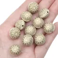 Hand holding vintage cream acrylic round beads with golden heart patterns for DIY jewelry - Flat Round Heart Bead / 15mm Approx. 20pcs/Pack / Black