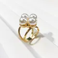 Close-up of elegant gold-plated scarf buckle with four large white pearls - Four Pearl Triple Ring Style (Style 1) / Gold
