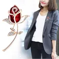 Elegant red crystal rose brooch for women shown on a grey blazer detail view - Red Rose (A6-71)