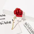Macro view of an elegant red enamel rose brooch with golden stem and crystals. - Rhinestone Embellished Rose Style (A8-32) / Red