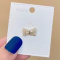 Luxuriöse goldene Schleifenbrosche für Strickjacken mit funkelnden Baguette-Steinen - Gold Baguette Rhinestone Bow-tie (A-94)