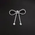 Elegant silver bow brooch with sparkling rhinestone tassels and teardrop crystal pendants - Bowknot Double Tassel Water Drop Style (A3-78)