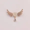 Elegant gold angel wing brooch featuring a rhinestone heart and teardrop crystal pendant. - Gold Heart Wings (A5-89)