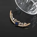 Elegant crescent moon brooch featuring a deep blue square gemstone and gold plating - Gold Moon Style (A18-58)