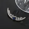 Elegant crescent moon brooch featuring a square sapphire blue gemstone and clear rhinestones. - Silver Moon Style (A18-59)