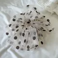 Detail view of a cream mesh scrunchie with brown polka dots for soft hair styling. - Large Coffee Large Dot Mesh Scrunchie