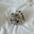 Close-up detail showing the mesh texture and polka dot pattern of this stylish scrunchie - Small Large Dot Mesh Scrunchie