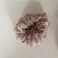 Close-up detail of a pink floral scrunchie hair tie with delicate white flower pattern - 10#
