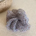 Detailed view of blue leopard print scrunchie made from lightweight sheer material - Scrunchie / Blue Leopard